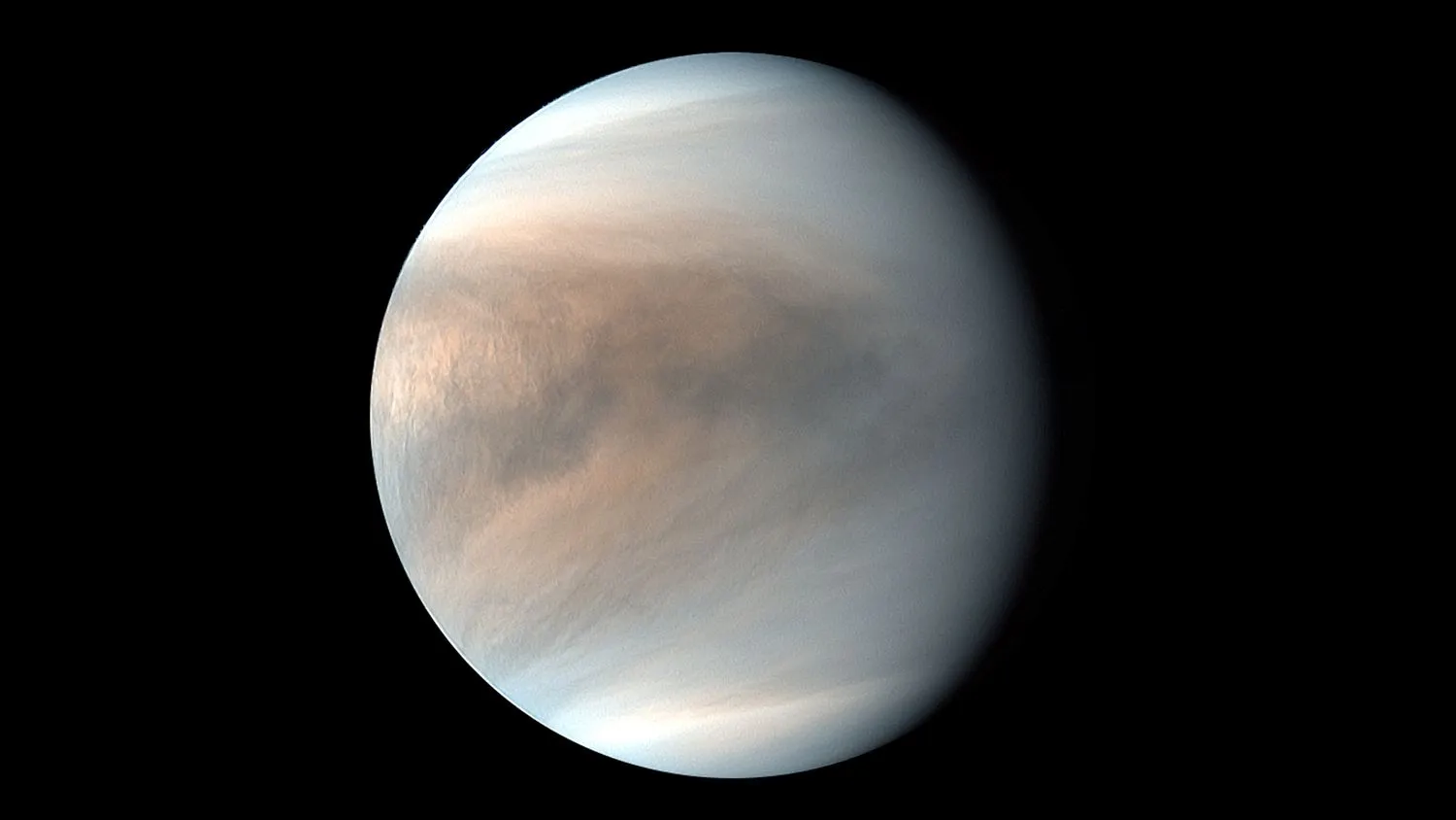 Auf diesem Foto einer Raumsonde ist die Venus vor der Schwärze des Weltraums zu sehen.