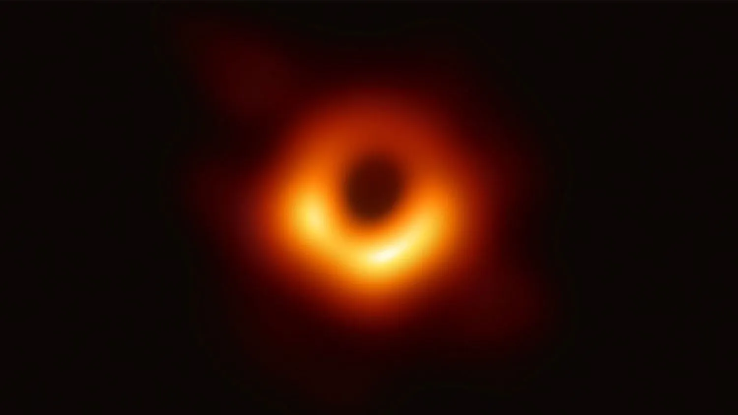 eine schwarze Scheibe, umgeben von einem orangen Ring
